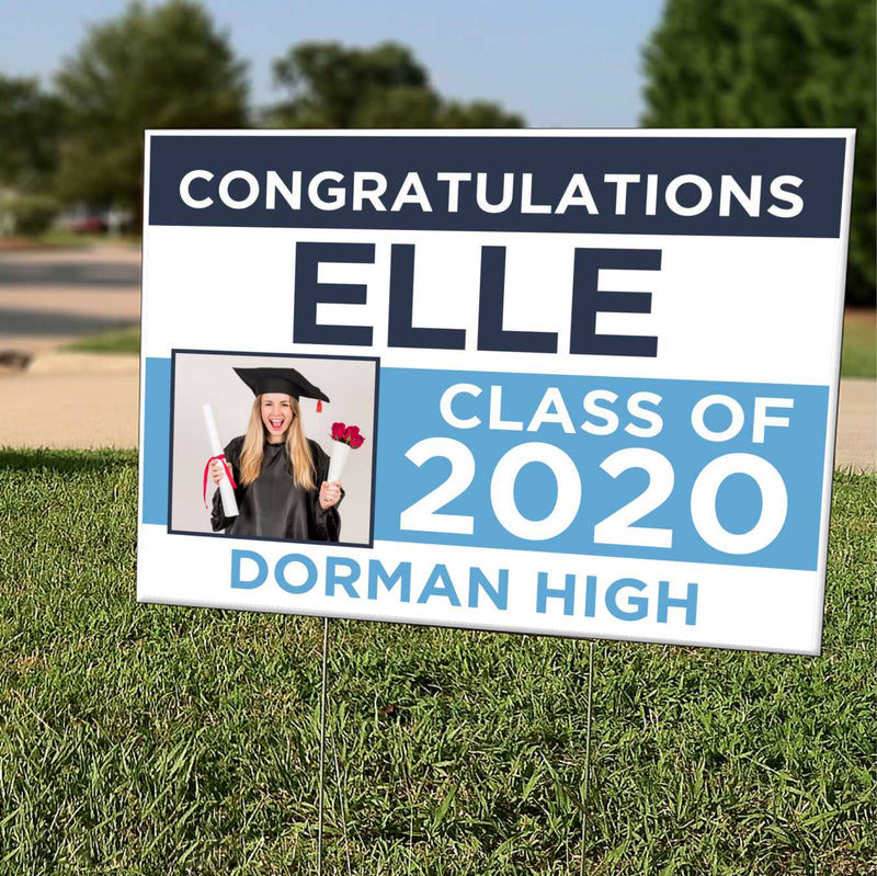 Personalized graduation yard sign with the graduate's name, photo and class year in a front yard
