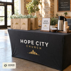 Fitted table cover in use at a church or event